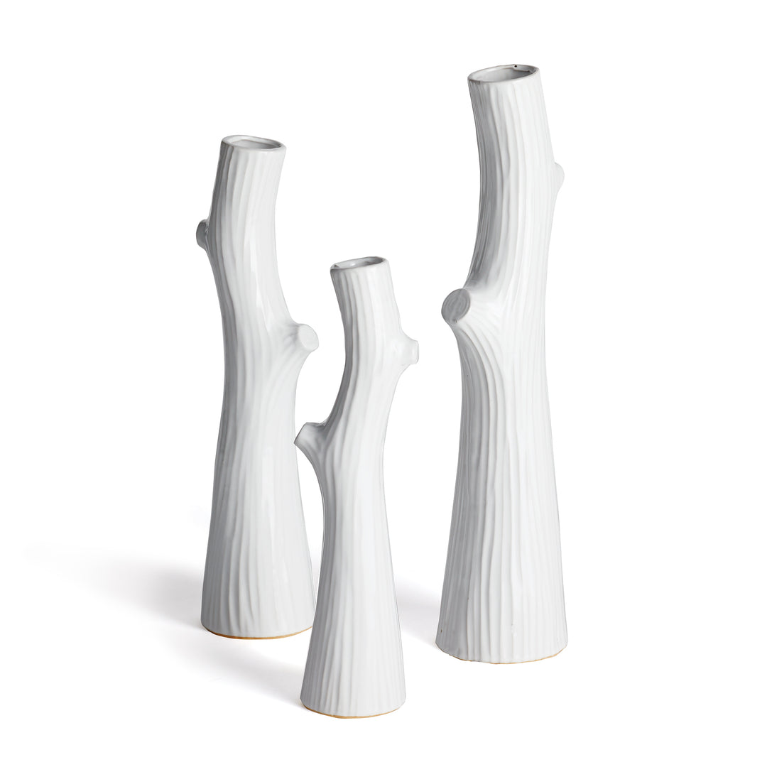 Three white ceramic faux bois vases with branch-shaped bodies and narrow openings, shown together on white - Modern Organic