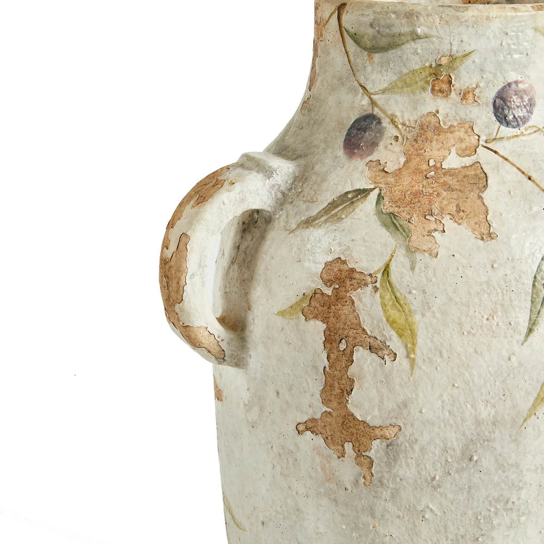 Side handle detail of white ceramic pot, showing cracked glaze and natural patina from artisan hand-finishing.