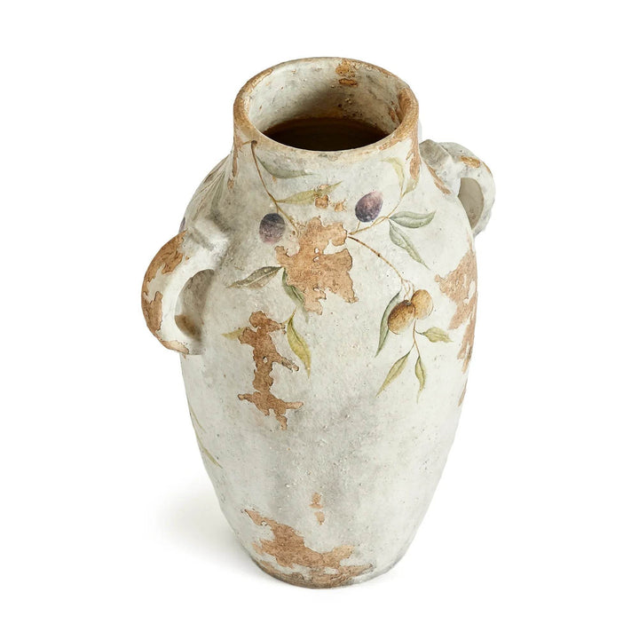 Top-down angle of white ceramic urn with dual handles and rustic flaking texture, placed on a white backdrop.