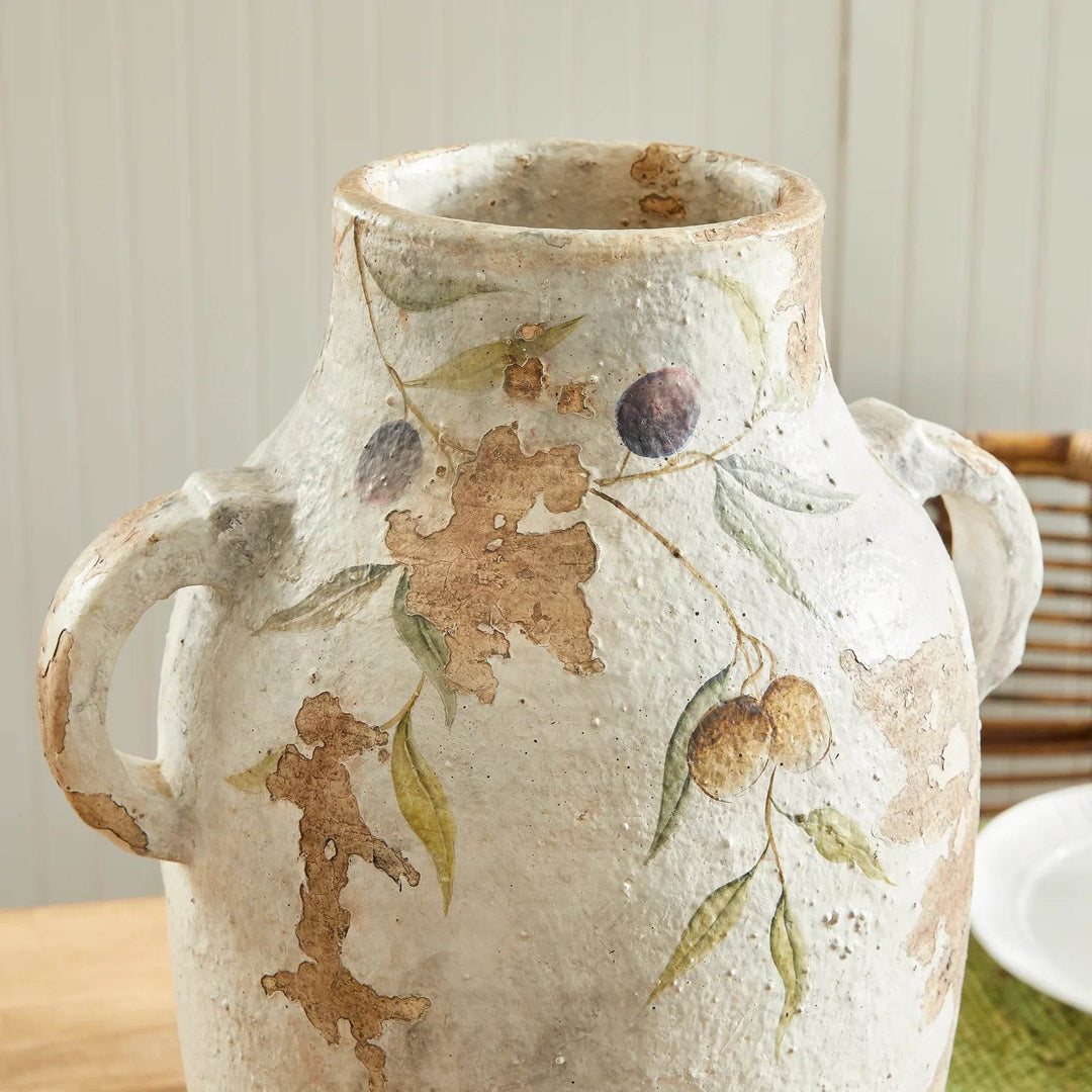 Zoomed view of olive vine painting on ceramic pot, highlighting artisan brushwork and aged texture effect.
