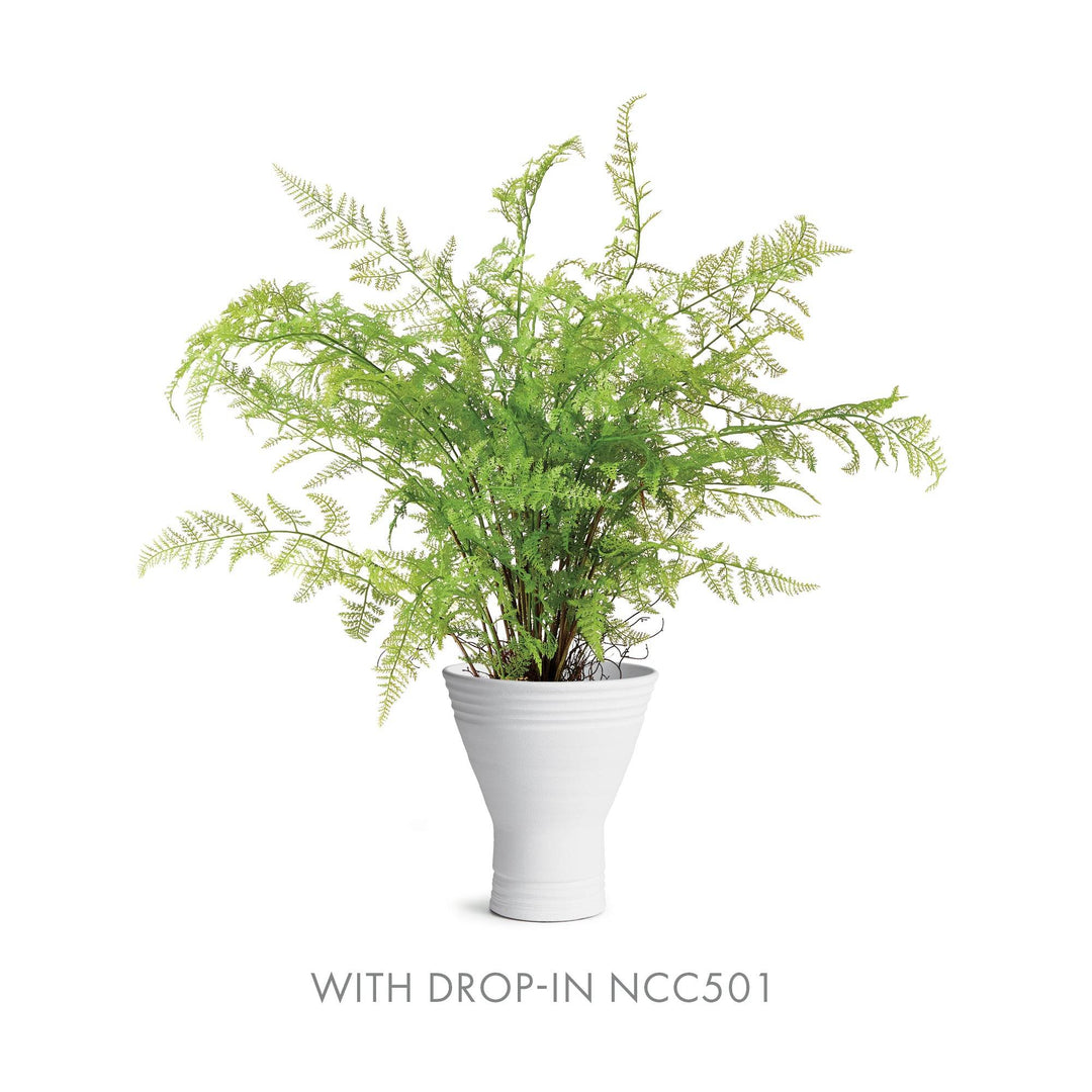 Fluted white ceramic vase holding faux fern drop-in NCC501, sculptural matte form with soft green foliage – Modern Organic.

