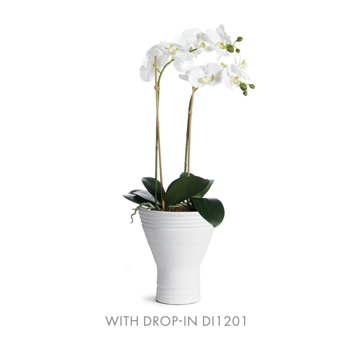 White fluted ceramic vase featuring orchid drop-in DI1201, 11" format styled for shelf or console accent – Modern Organic.

