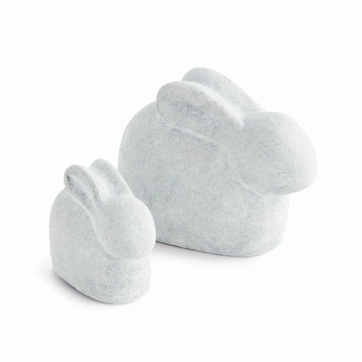 Set of two white concrete rabbit sculptures in graduated sizes with soft graywashed finish for tabletop decor – Modern Organic.