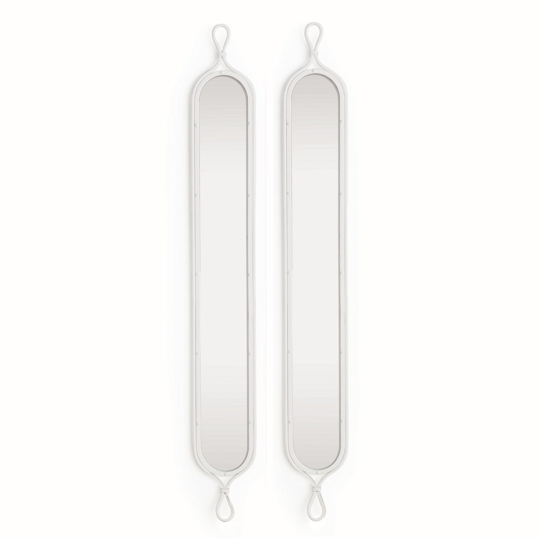 Overhead view of matching pair of white French loop mirrors styled for modern coastal or Scandinavian entryways.

