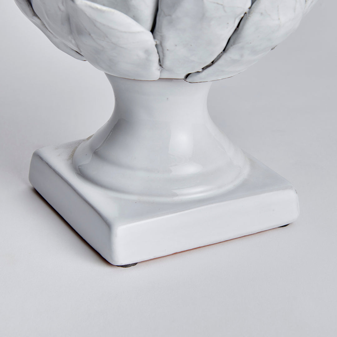 Large white terracotta artichoke finial detail showing the curved stem and square base beneath layered leaves - Traditional