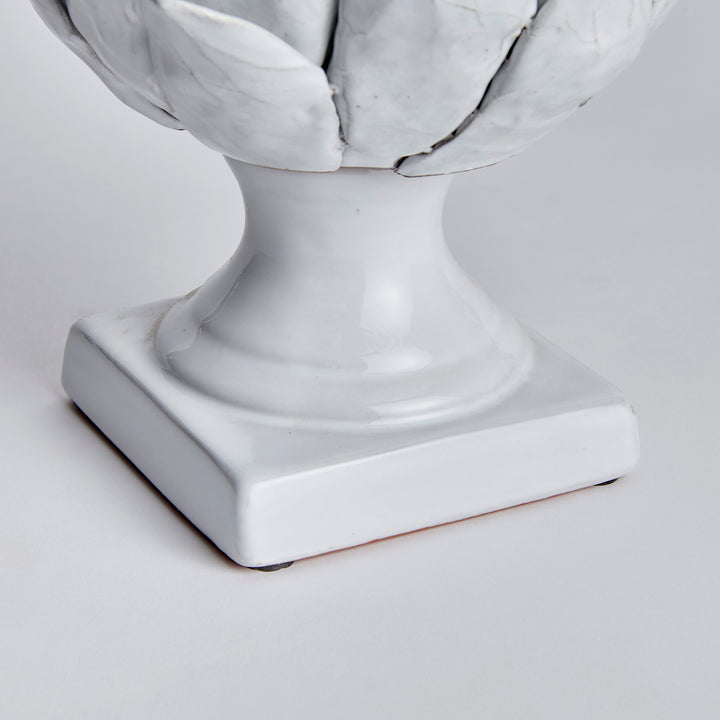 Large white terracotta artichoke finial detail showing the curved stem and square base beneath layered leaves - Traditional