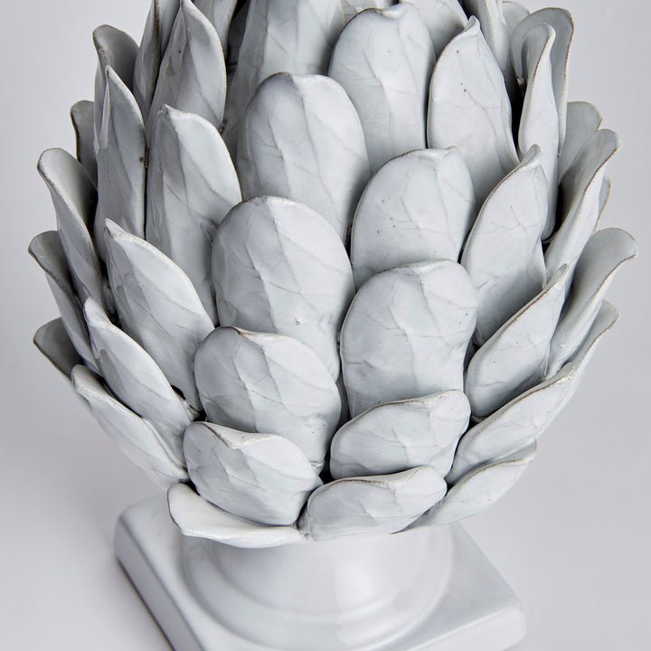Large white terracotta artichoke finial detail showing overlapping leaves and veining in its reactive glaze - Transitional