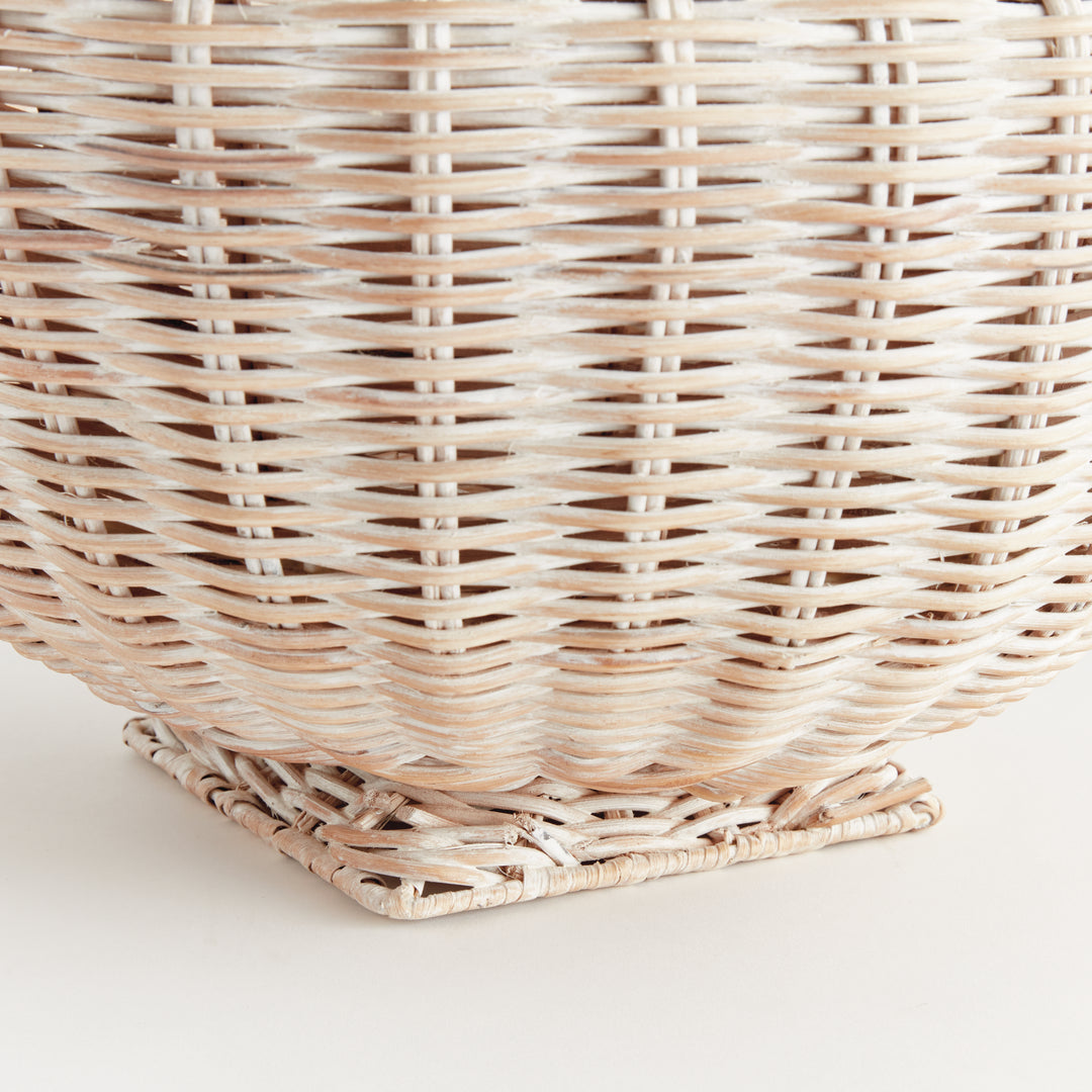 Whitewash rattan footed bowl close-up showing fine woven strands and the wrapped square pedestal base - Coastal Transitional