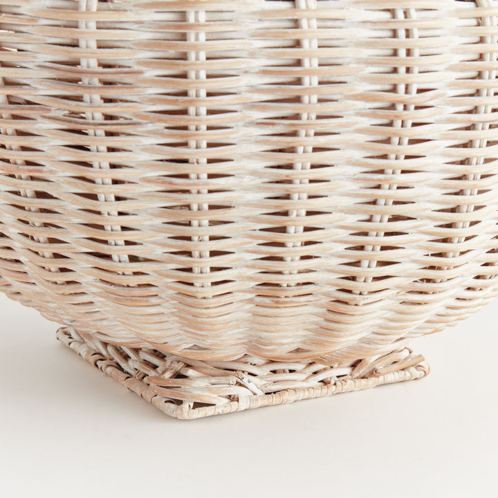 Whitewash rattan footed bowl close-up showing fine woven strands and the wrapped square pedestal base - Coastal Transitional