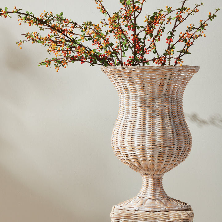 Handwoven tall whitewash rattan footed urn styled with faux botanical branches for elegant coastal décor – Coastal.