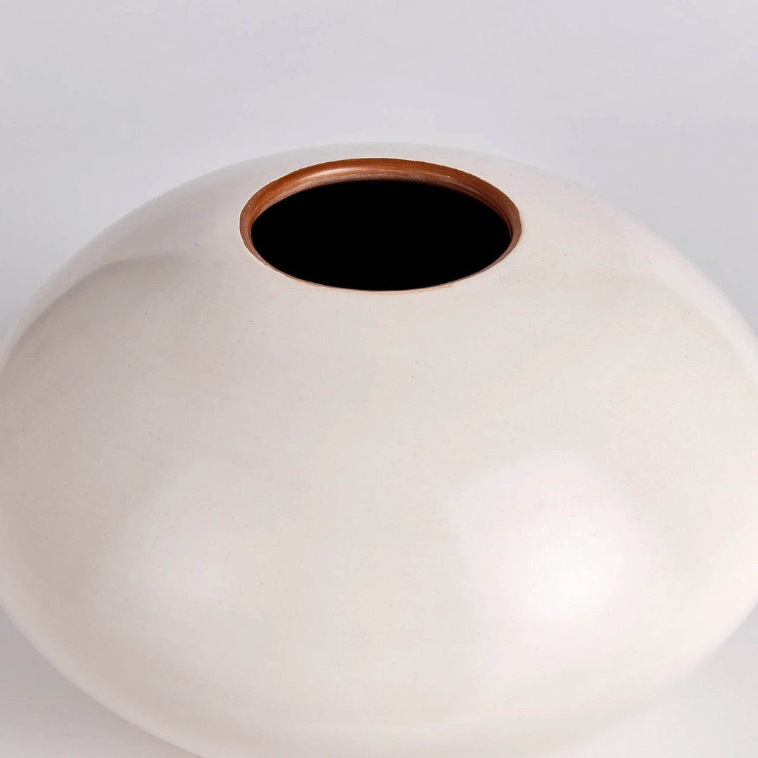 Closeup top view of modern organic beige ceramic vase with wide mouth – 13 inch.

