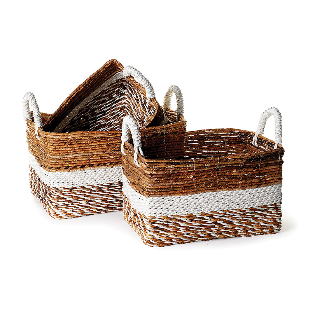 Set of three woven storage baskets in natural and white tones, partially stacked to show form and size – Boho Natural