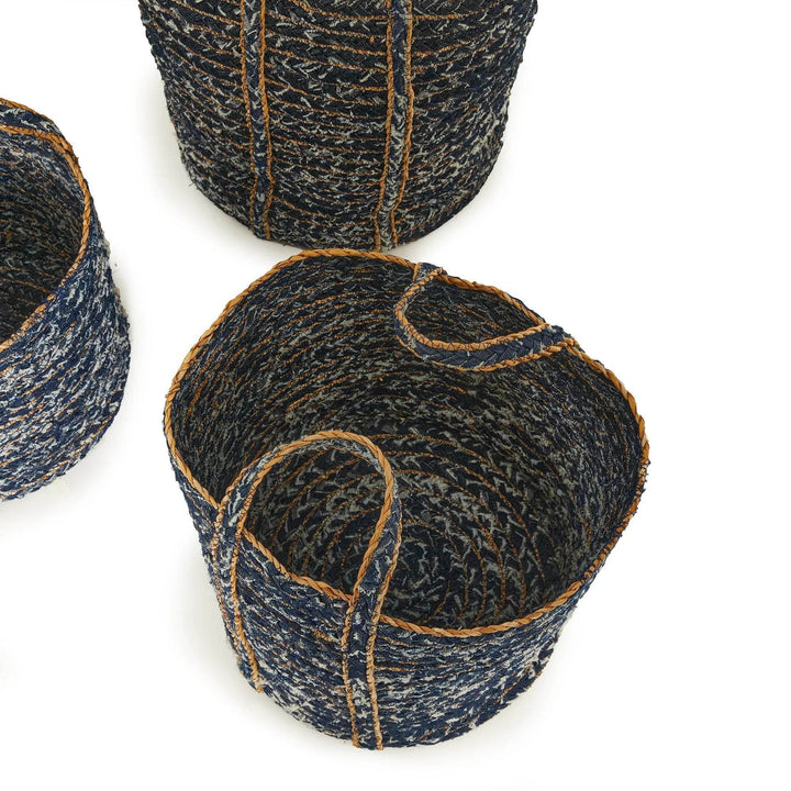 Recycled denim basket trio styled next to furniture for casual storage display