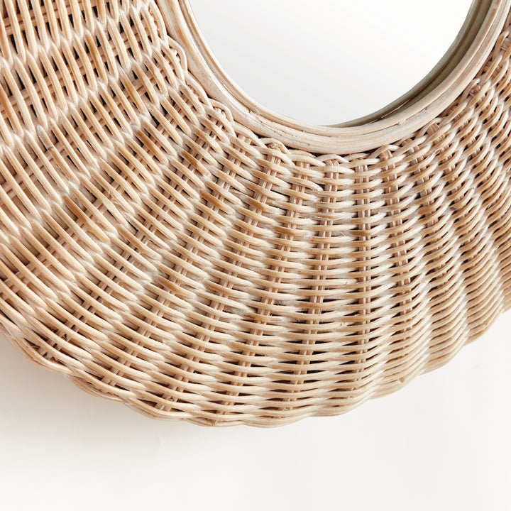 Front view of round whitewashed rattan wall mirror with wide woven frame and centered glass, styled against clean white backdrop.