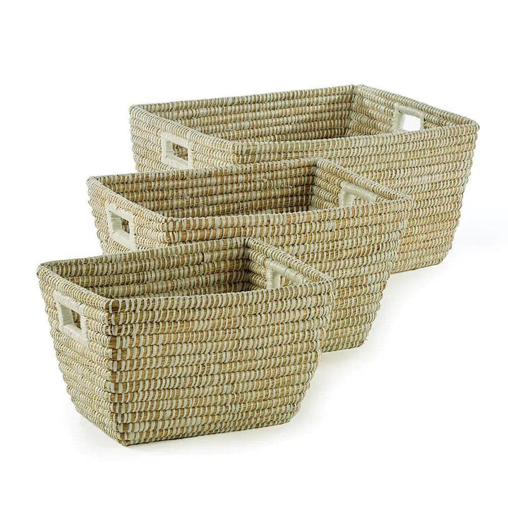 Set of three woven storage baskets with handles shown nested together, perfect for modern coastal home organization.