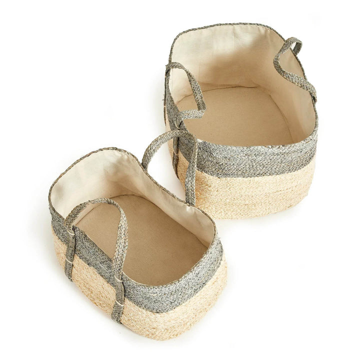 Woven rectangular storage baskets with handles, gray and natural corn husk weave, indoor storage solution for blankets or toys.

