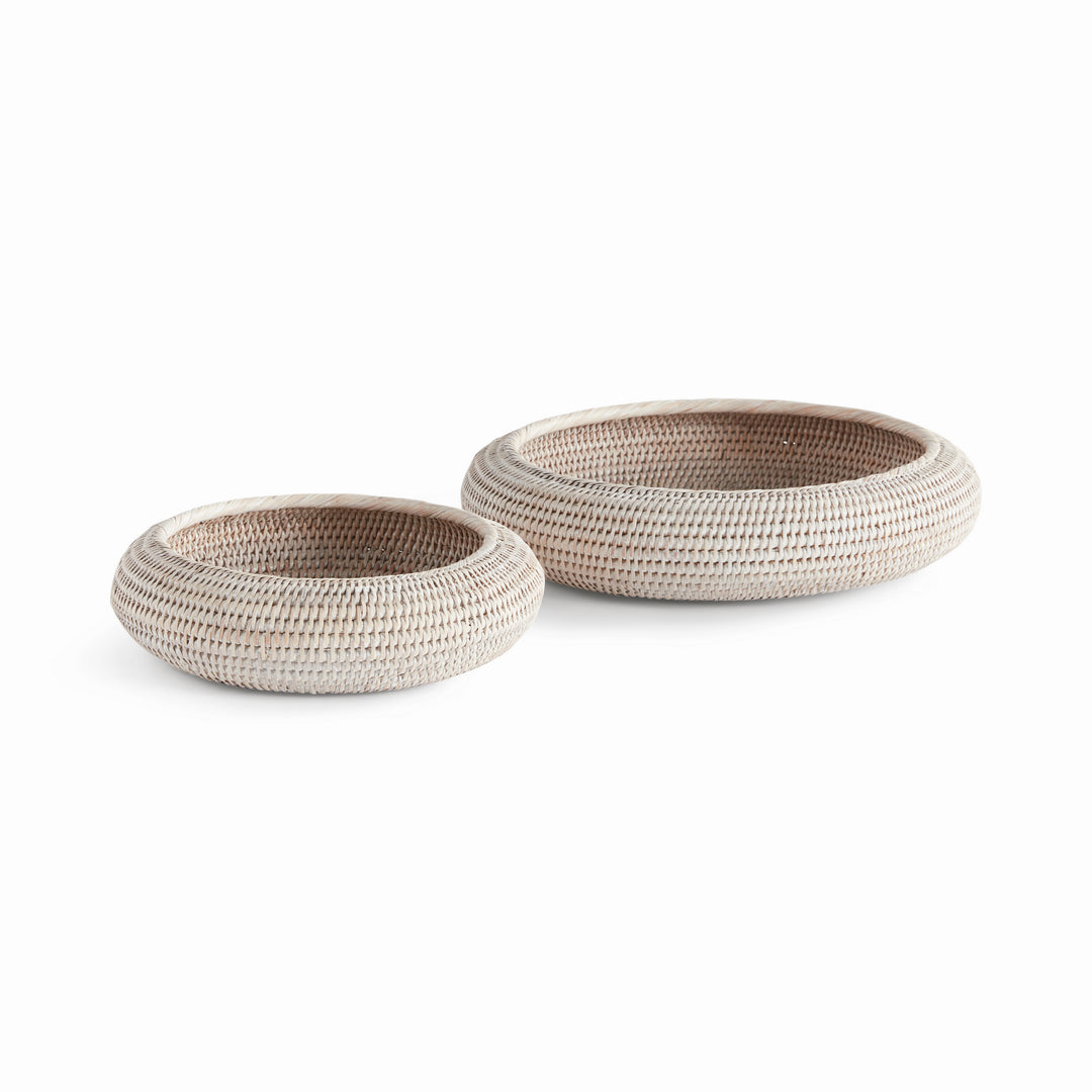Whitewash rattan shallow display bowls in two sizes with rounded sides and thick rims, shown on white - Coastal Transitional