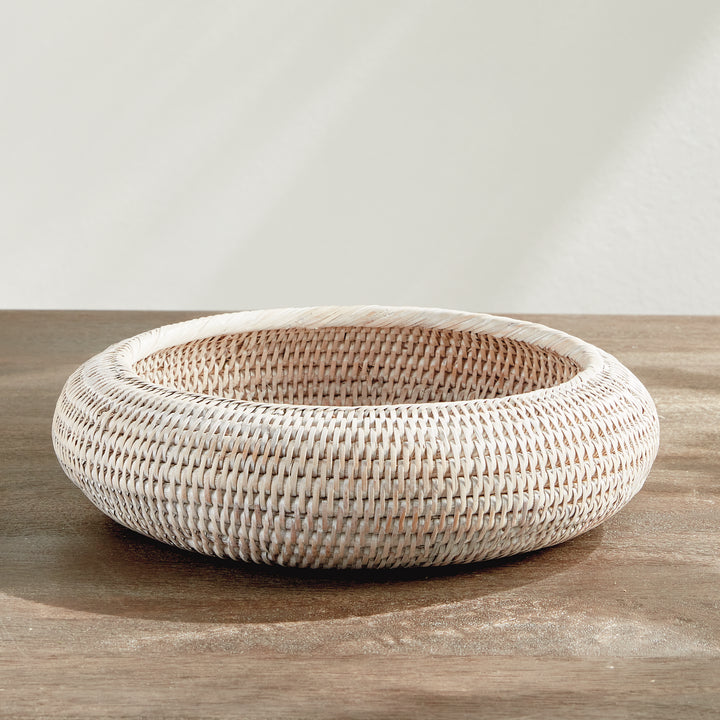 Whitewash rattan shallow display bowl shown empty on a tabletop, with a broad opening and curved rim - Coastal Transitional