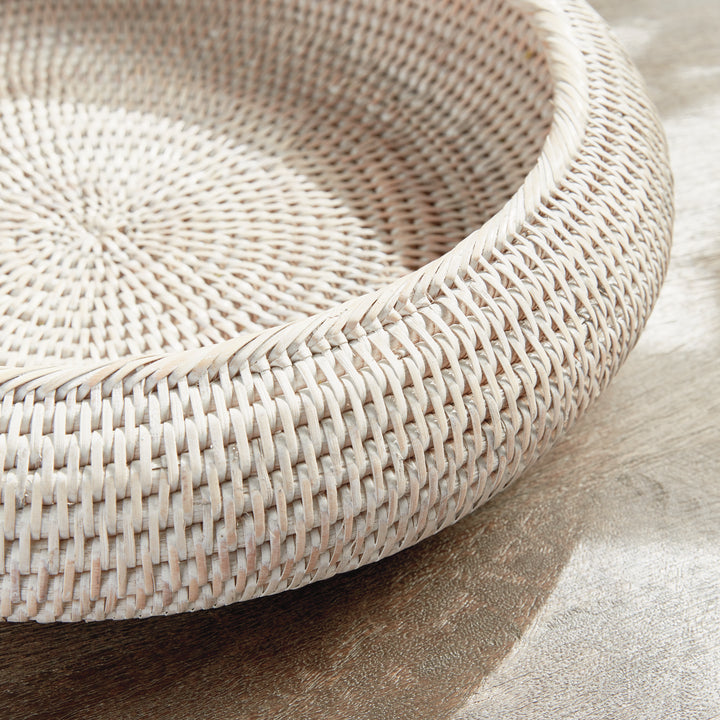 Whitewash rattan shallow display bowl close-up showing the thick wrapped rim and patterned woven base - Coastal Transitional